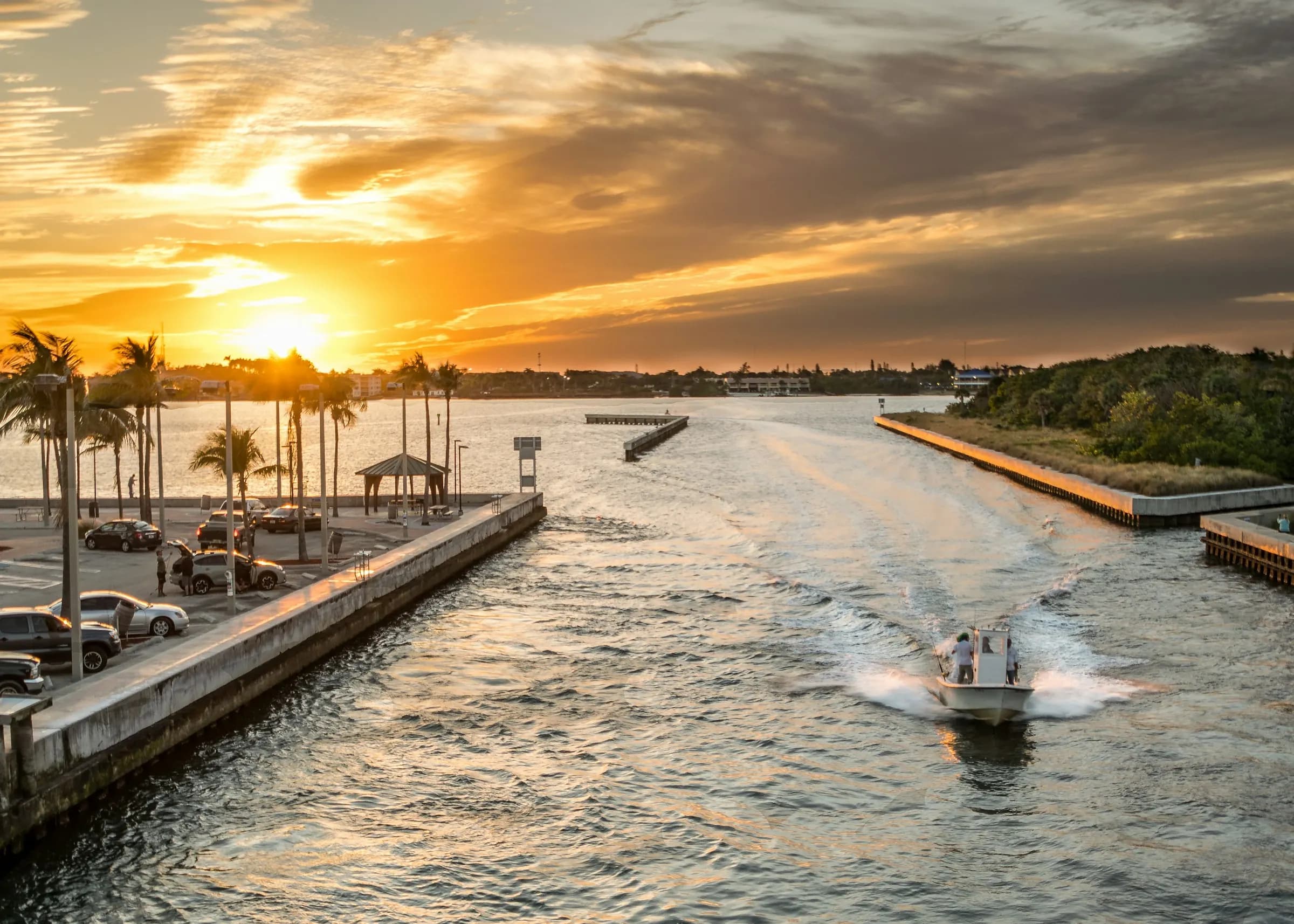 Sailboats on the water near the Boynton Inlet at sunset, near Briny Breezes