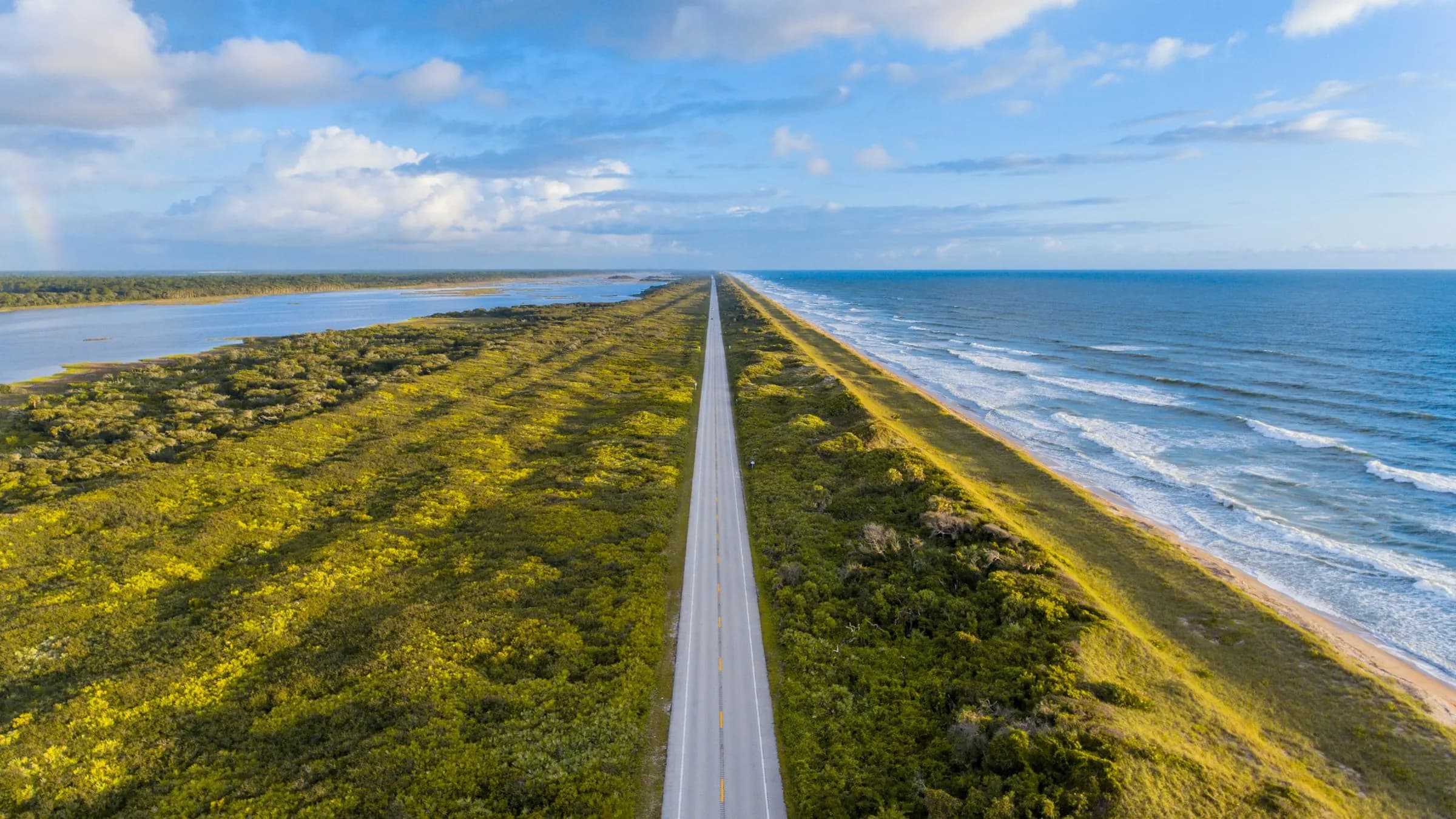 Aerial view of a coastal road between the Atlantic and dune vegetation, near Lake Park