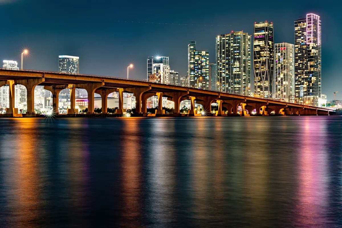 Venetian Causeway and the Miami skyline lit at night over Biscayne Bay