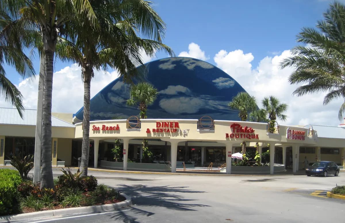 The Sea Ranch Lakes shopping center dome framed by palm trees